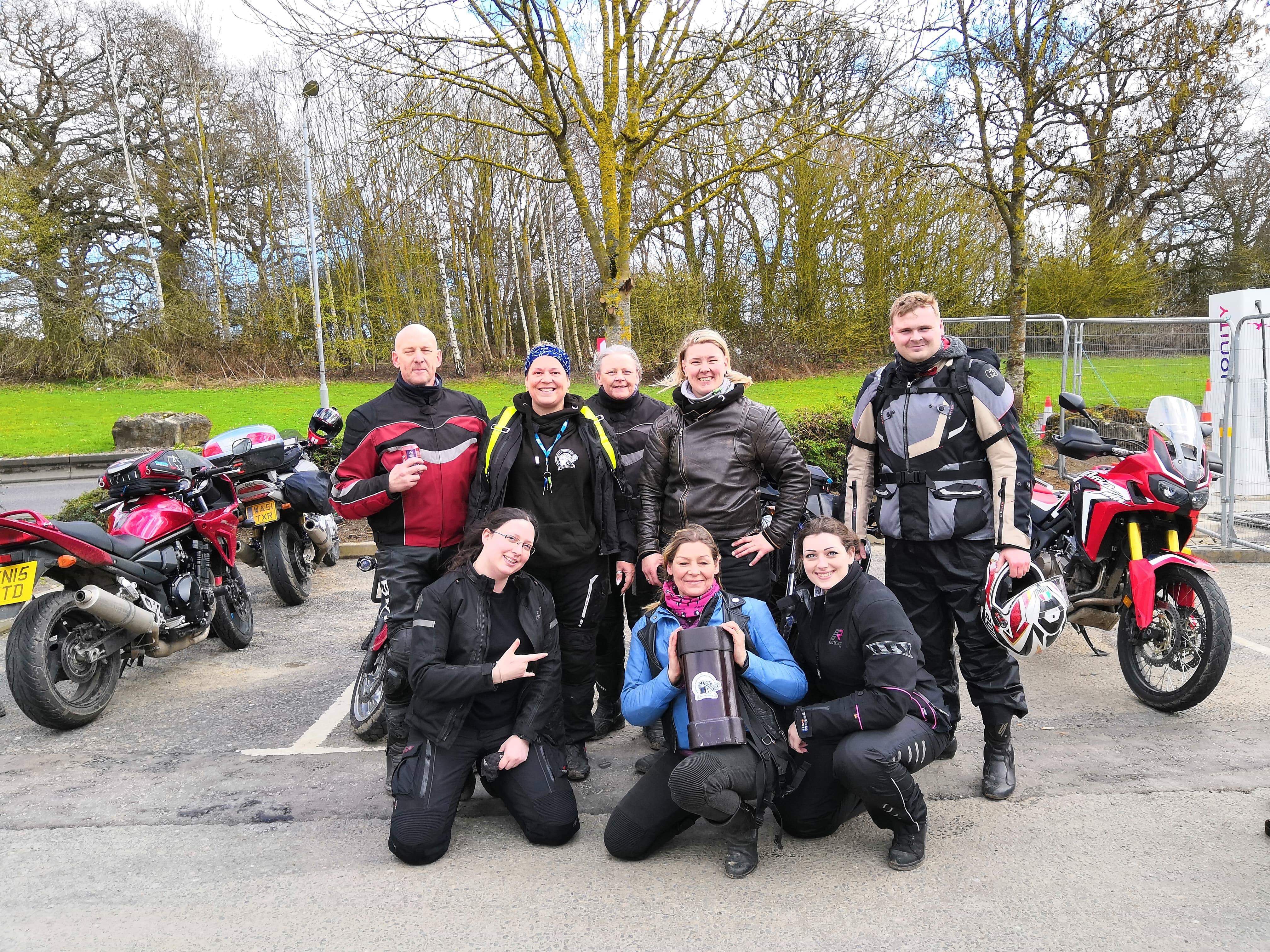 Debbie holding the baton surrounded by WRWR guardians