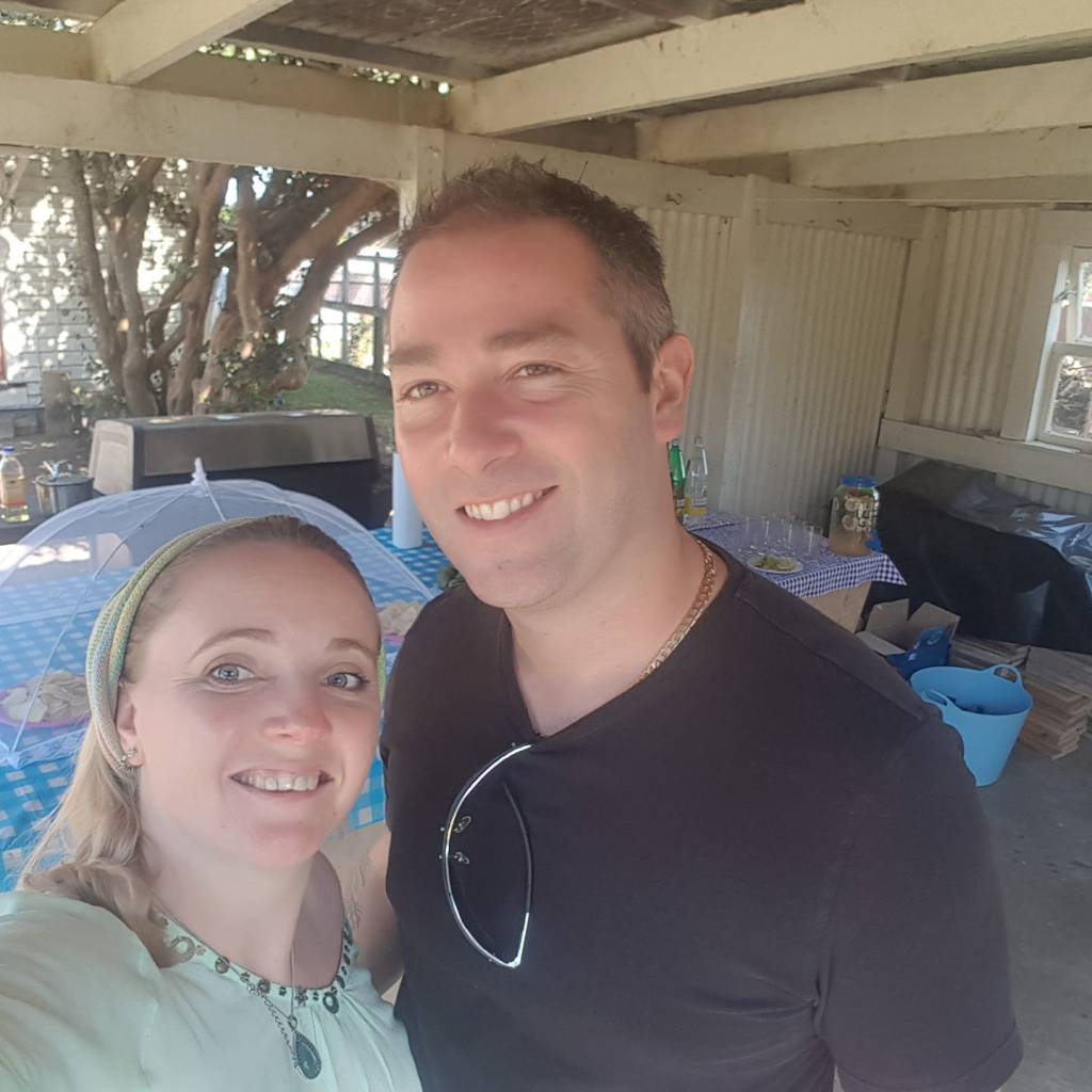My husband and I at our house warming in New Zealand
