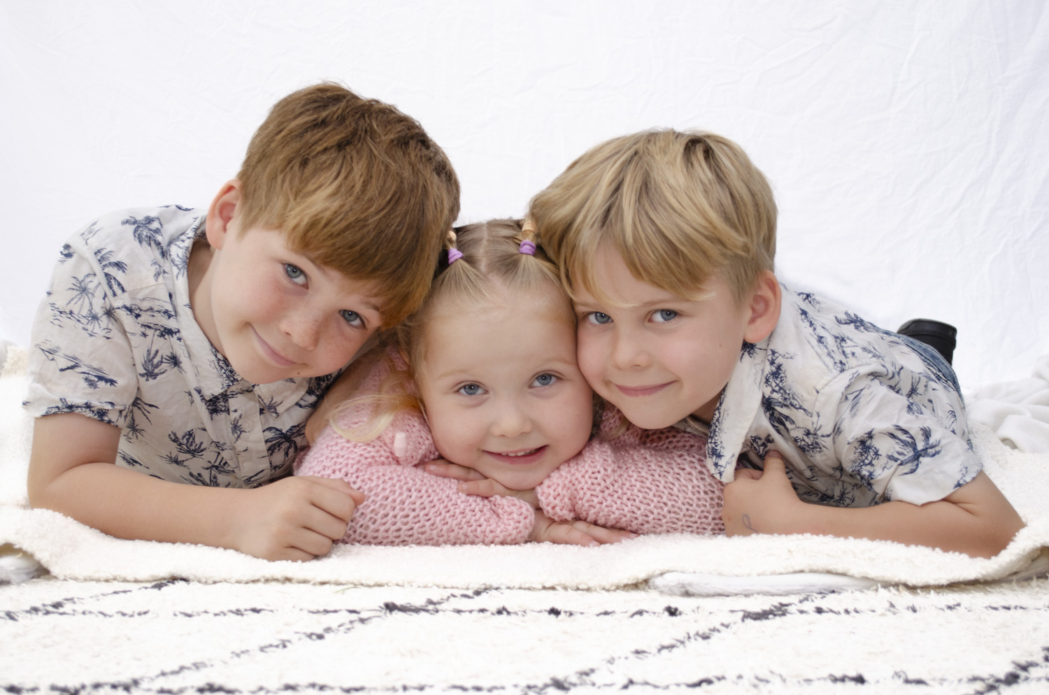 Children's family portrait photo of three young siblings. Taken by Te Awamutu, Waikato based photographer, Donna from Donna May Photography.