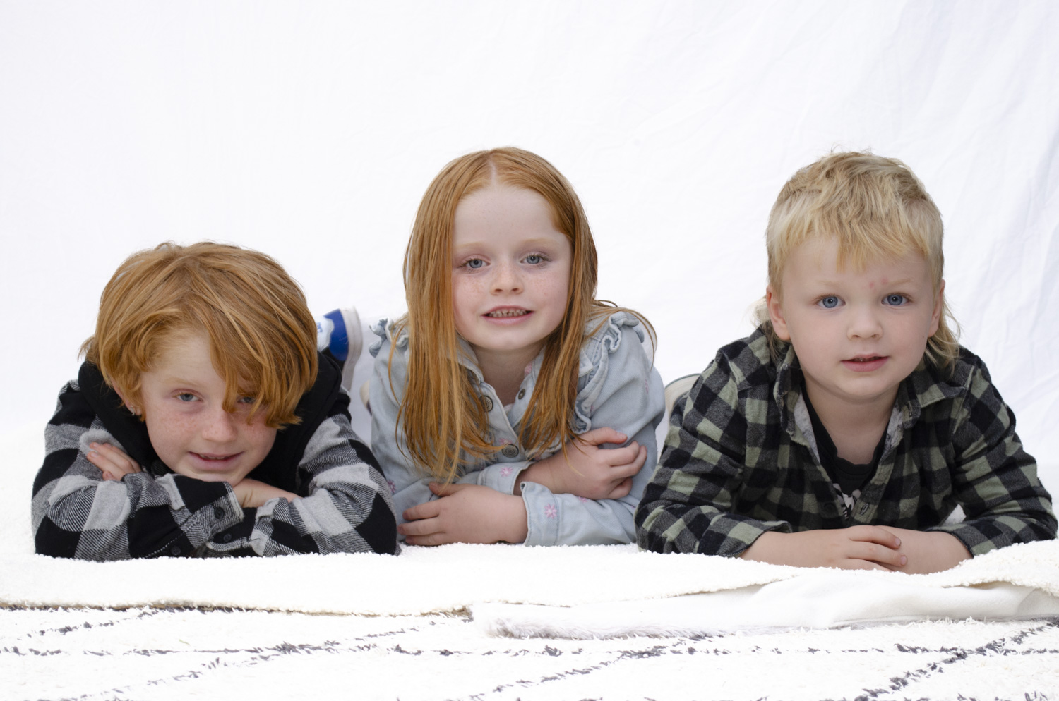 Children's family portrait photo of three young siblings. Taken by Te Awamutu, Waikato based photographer, Donna from Donna May Photography.