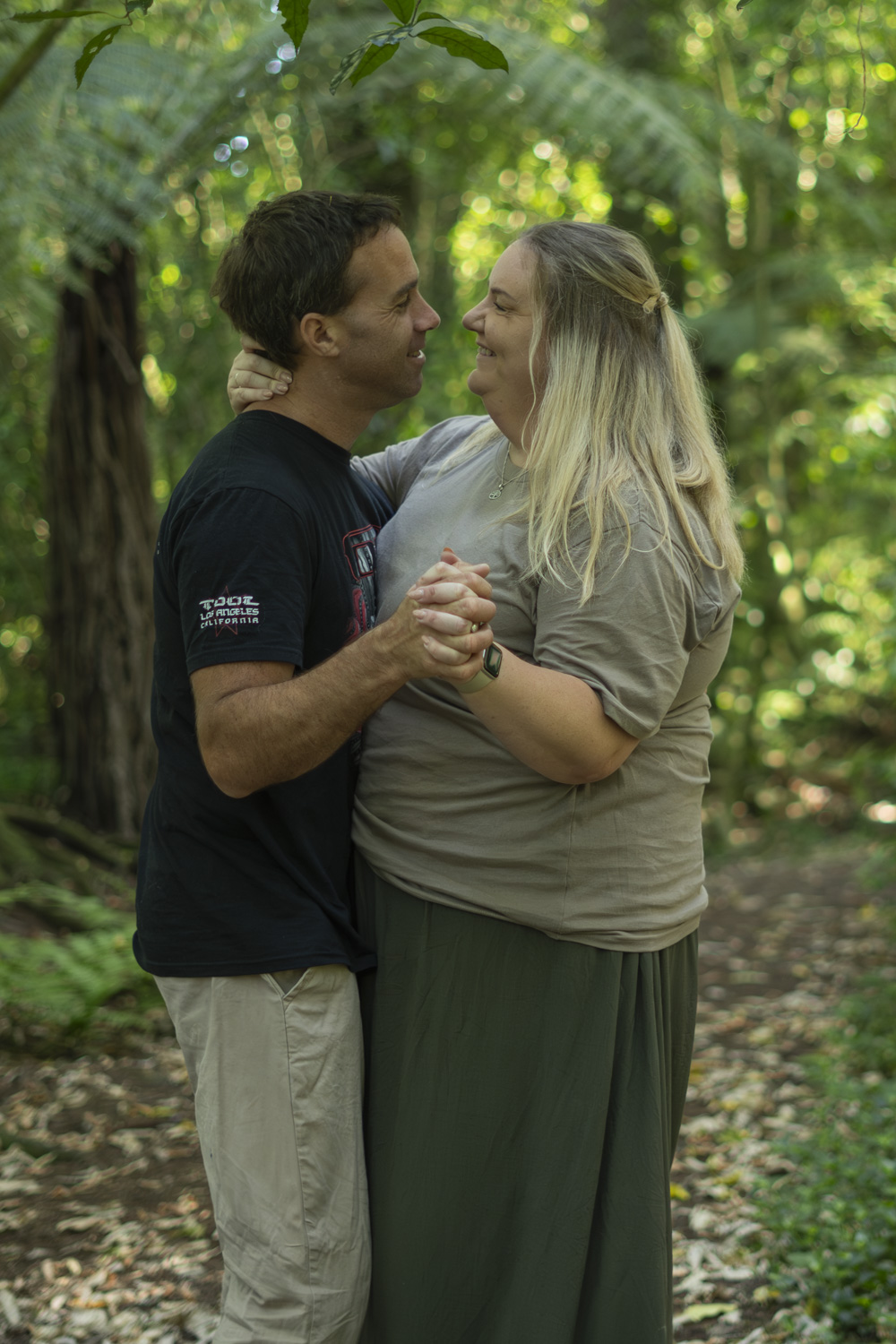 An intimate portrait photo of a couple dancing in the forest. Taken by Te Awamutu, Waikato based photographer, Donna from Donna May Photography