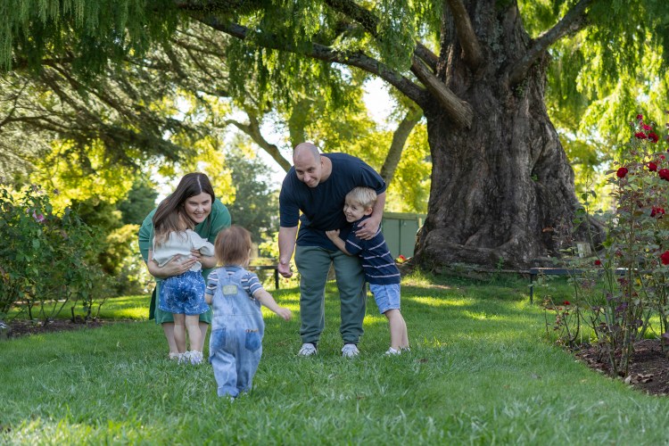 A lifestyle family portrait photo of a young family. Taken by Te Awamutu, Waikato based photographer, Donna from Donna May Photography.