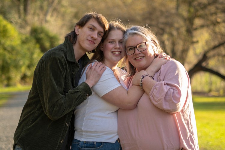 A family portrait photo of a mum and her two grown up kids. Photo taken by Te Awamutu, Waikato based photographer, Donna from Donna May Photography.